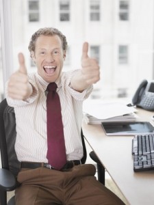 Businessman giving thumbs up
